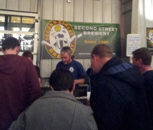 Folks check out the long list of beer options that Second Street brought to WinterBrew.