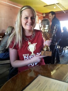 Event organizer Marne Gaston shows off one of the trophies that will be handed out at Saturday's New Mexico Cup.