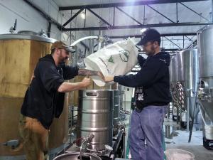 Porter Pounder, left, and Stoutmeister work on our beer at Tractor Wells Park.