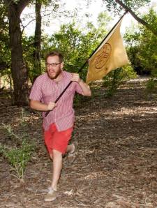Zack of the Ale Republic runs with their flag through the Bosque to, um, make a nice picture?