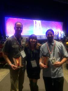 Marble's trio of brewers posed with their medals and awards in Denver. (Photo courtesy of Marble Brewing)