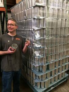 Doug shows off the new crowlers that you will soon be able to fill with purchased beer at Canteen.