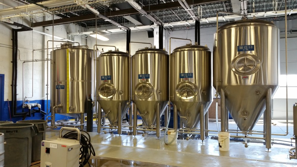 The current lineup of fermenters and the hot liquor tank on the left.