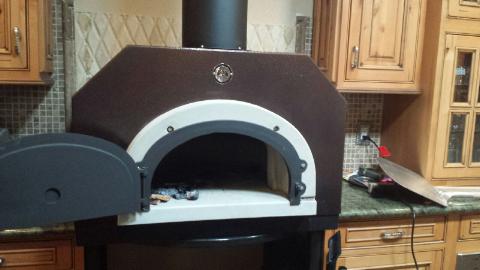 The new wood-fired pizza oven should be fired up in the next month.