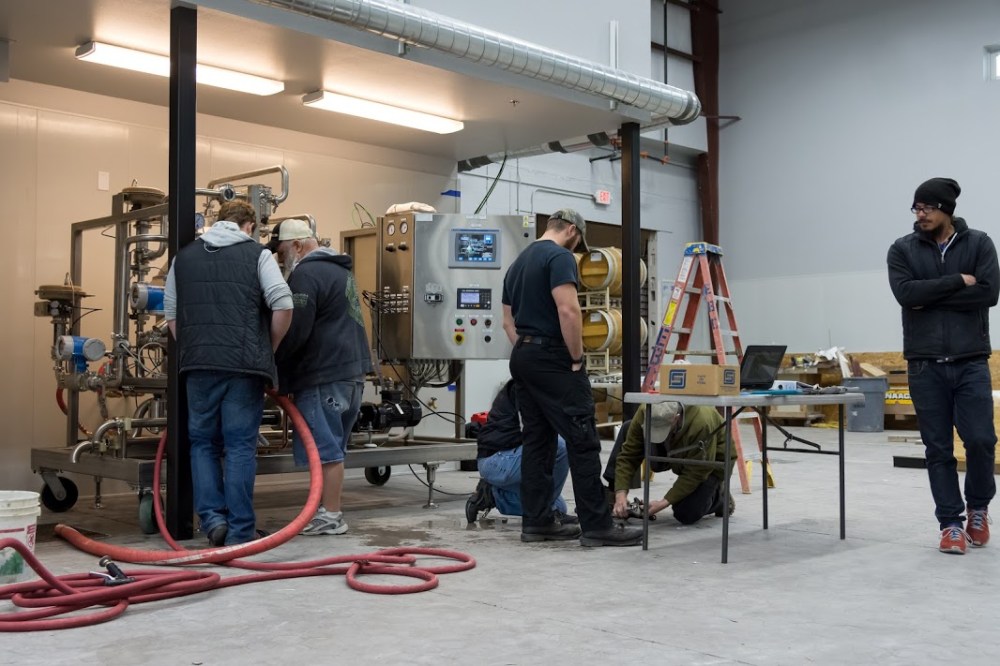 The staff was hard at work getting the centrifuge ready to go. 