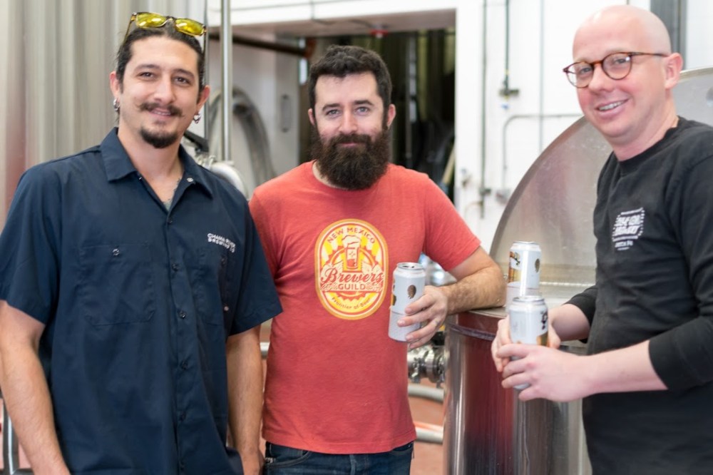 The brewer in the center of this photo, Tim Woodward, is changing breweries later this month. (Photo by Mario Caldwell)