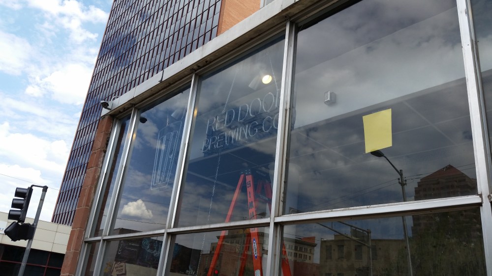 The neon sign was a requirement by the owners of the Simms Building to keep with the retro vibe.