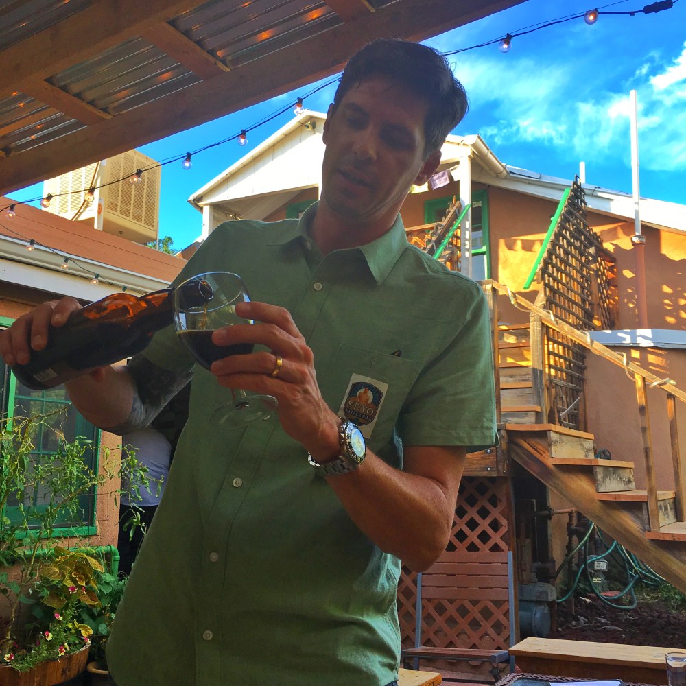 Tommy Dineen pours some special XIX Anniversary Ale for the table.