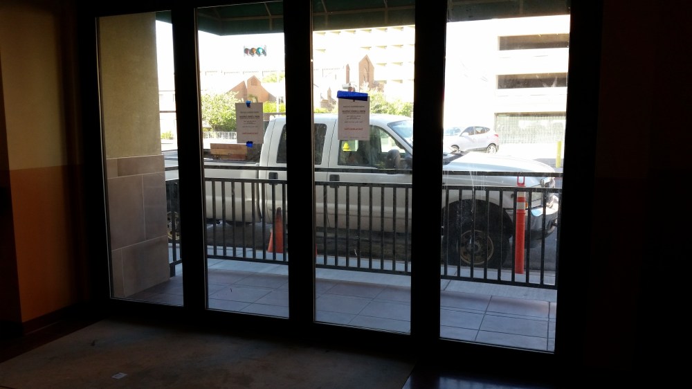 A small, standing-room only patio is on the west side.