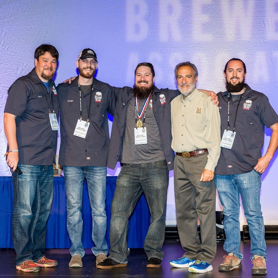 The team with Charlie Papazian after winning gold for The Red Glove. (Photo courtesy of the Brewers Association)