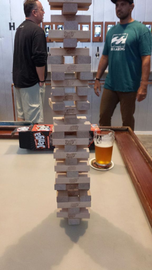 Behind the ubiquitous Giant Jenga, note those two watch-like devices on the wrists of the customers. That's what keeps track of your beer pours.