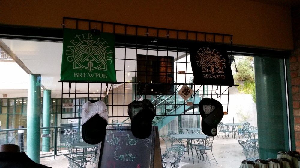 Wait for cloud cover, then take a slightly less back-lit photo of the QC merch.