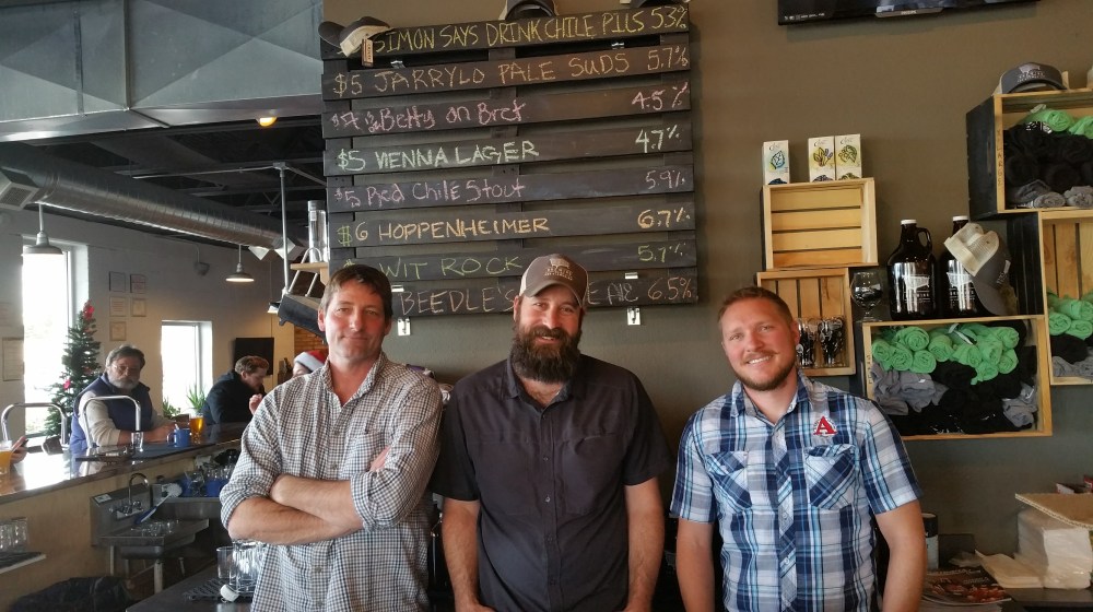 Incoming GM Doug Osborn, outgoing GM Jason Fitzpatrick, and head brewer Nic Boyden.